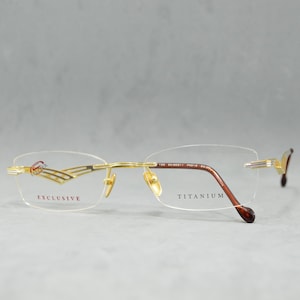 Top Titanium Vintage Rimless EyeGlasses STEPPER EX-50311 FX012. NOS. Unworn. Unisex Woman Man. 00s. Rectangular. Eyewear. Golden, silver.