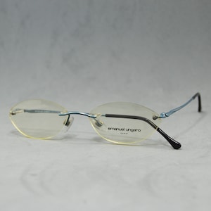 Emanuel Ungaro Vintage Rimless EyeGlasses NOS Unworn Classic round oval Unisex man Woman Rx eyewear 00s Metal blue black Stainless steel