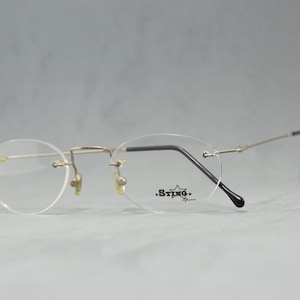 Vintage Rimless EyeGlasses STING NOS Unworn Classic round Unisex man Woman Rx eyewear 90s 00s Silver Black Flexible Stainless steal
