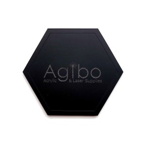 May include: Black hexagonal acrylic coaster with the text "Agibo Acrylic & Laser Supplies" engraved in silver.