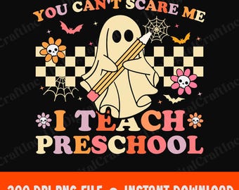 May include: A black graphic with the text "YOU CAN'T SCARE ME I TEACH PRESCHOOL". The design features a ghost holding a pencil, bats, flowers with skulls, and spiderwebs. The text is in various colors, with an orange and white checkered pattern.