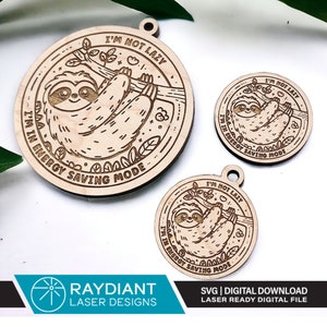 May include: Three wooden ornaments featuring a sloth design with the text "I'm not lazy, I'm in energy saving mode".