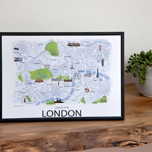 Puede incluir: Un mapa enmarcado de Londres con un diseño de estilo acuarela. El mapa incluye puntos de referencia y un texto que dice "Lingo for London".