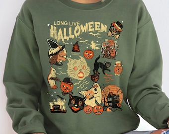 May include: Olive green sweatshirt with a vintage Halloween graphic. The graphic includes a witch, black cat, pumpkins, ghosts, and the text "LONG LIVE HALLOWEEN". The design has a retro, distressed look.
