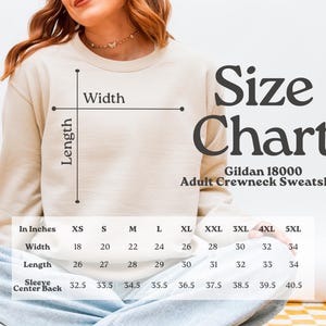 a woman wearing a Gildan 18000 Adult Crewneck Sweatshirt, with a size chart displayed below her.