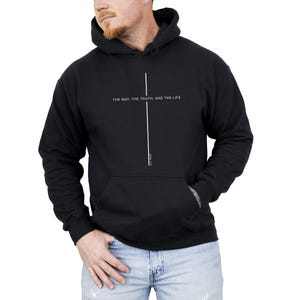 May include: Black hooded sweatshirt with a white cross and the text "THE WAY, THE TRUTH, AND THE LIFE" and "JOHN 14:6" in white.
