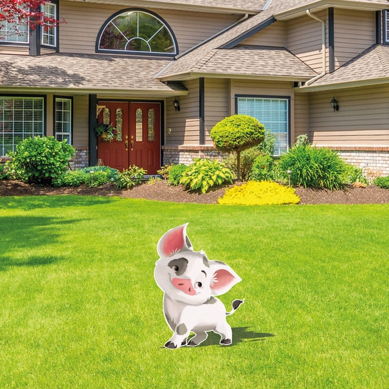 May include: A flat, cutout yard sign featuring a cartoon piglet with white fur, grey patches, and large pink-lined ears. The piglet has a small snout, dark eyes, and a thin tail, standing in a pose with one front leg slightly raised on the grass.