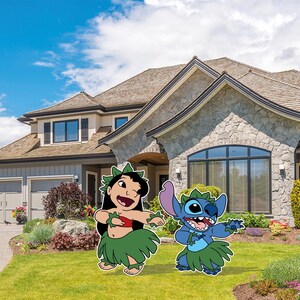May include: Two cartoon cutouts of Lilo and Stitch dancing on a green lawn in front of a large house. Lilo is wearing a red top and green skirt. Stitch is blue with a green skirt. The sky is blue with white clouds.