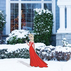 May include: A cartoon illustration of a woman in a red dress standing in a snowy yard. The woman has blonde hair and is wearing a red dress with a white collar. The yard is covered in snow and there are bushes in the background.