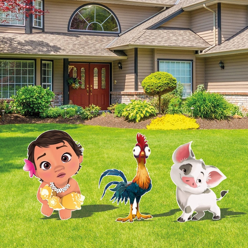 May include: Three decorative yard signs featuring a cartoon toddler with a pink flower in their hair, a colorful rooster with large eyes, and a small white pig with black spots, all standing on a green lawn in front of a residential house.