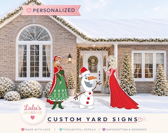 May include: Custom yard signs featuring cartoon characters Anna, Olaf, and Elsa in winter attire. The signs are displayed in a snowy front yard. Text includes "PERSONALIZED", "Lulu's JAMBOREE", "CUSTOM YARD SIGNS", "MADE WITH LOVE", "THOUGHTFUL DETAILS", and "UNFORGETTABLE MEMORIES".