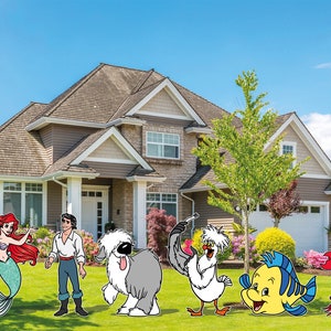 May include: Colorful outdoor yard decorations featuring characters from a popular animated film. The characters include a mermaid with red hair, a prince, a shaggy dog, a seagull, a yellow fish, and a red crab, all set in front of a house.