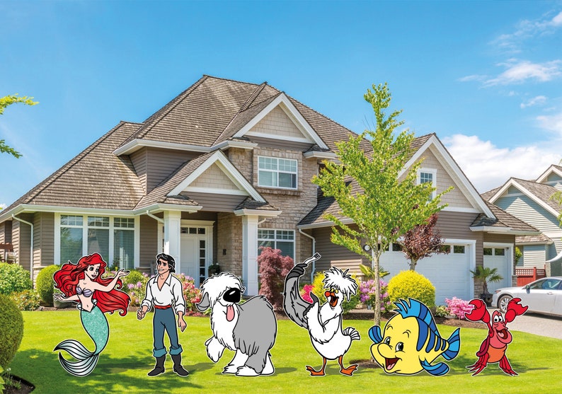 May include: Colorful outdoor yard decorations featuring characters from a popular animated film. The characters include a mermaid with red hair, a prince, a shaggy dog, a seagull, a yellow fish, and a red crab, all set in front of a house.