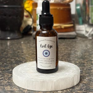 evil eye oil, ritual protection oil, spelled protection oil, body oil, evil eye, remove evil eye, jealousy, negativity, protection spell