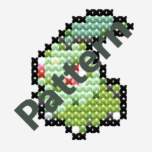 Può includere: Schema di punto croce di un personaggio Pokemon verde, nero e bianco. Il personaggio ha macchie rosse e un contorno bianco.