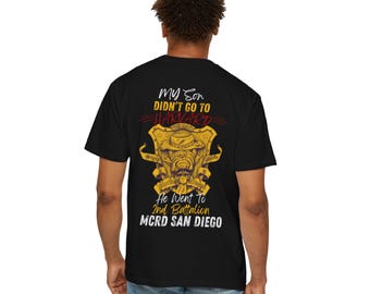 May include: Black t-shirt with a graphic on the back. The graphic features a bulldog wearing a hat, with text that reads "My Son Didn't Go To Harvard, He Went To 2nd Battalion MCRD San Diego."