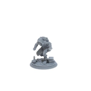 May include: A gray 3D printed miniature of a hooded figure crouching on a circular base with a small bottle and books.