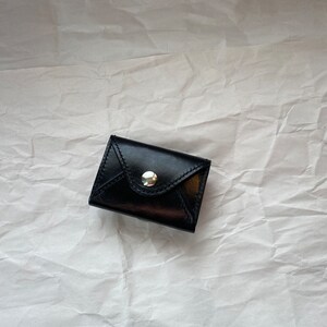 Cartera tipo sobre negra