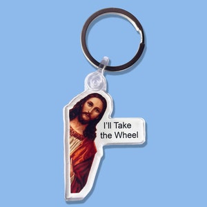 May include: A clear plastic keychain with a picture of Jesus and the text "I'll Take the Wheel".