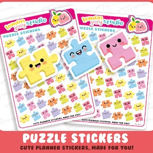 Pode incluir: Duas folhas de autocolantes de puzzle coloridos com rostos sorridentes. Os autocolantes são de várias cores, incluindo amarelo, azul e rosa. O texto "Lemon Jelly Studio" e "Puzzle Stickers" é visível. A parte inferior da imagem diz "Cute Planner Stickers, Made for You!"