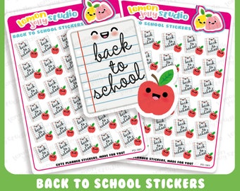 Könnte beinhalten: Ein Set mit 36 Planer-Aufklebern zum Thema Schulbeginn mit einem roten Apfel mit einem lächelnden Gesicht und dem Text "back to school". Die Aufkleber sind auf weißem Hintergrund mit einem blau-weiß karierten Muster.