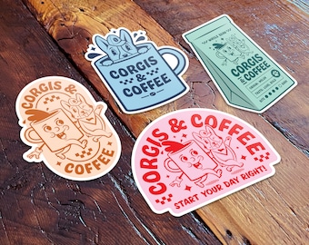 May include: Three stickers featuring a cartoon corgi and a coffee cup. The stickers are in different colors and designs. One sticker is blue with the text "Corgis & Coffee". Another sticker is orange with the text "Corgis & Coffee". The third sticker is pink with the text "Corgis & Coffee" and "Start your day right!"