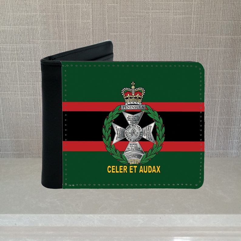 May include: A black leather wallet with a green, red, and black design. The wallet features a crest with the words "The Royal Green Jackets" and "Celer et Audax".