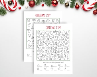 May include: Two white paper sheets featuring a Christmas I Spy game with black line art icons of holiday items like reindeer, snowmen, gifts, and trees. Each sheet includes a grid of icons and a section at the bottom to count each item.