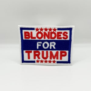 May include: White embroidered patch with red and blue text that reads "Blondes for Trump" with five red stars above and below the text.
