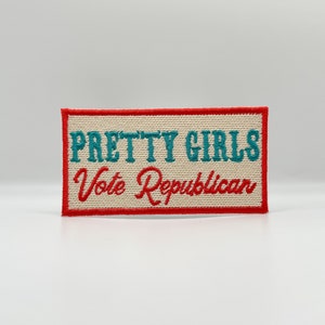 May include: A white fabric patch with red and teal embroidery. The text reads "Pretty Girls Vote Republican".