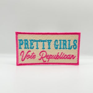 May include: A beige embroidered patch with pink stitching. The patch says "Pretty Girls Vote Republican" in blue and pink lettering.