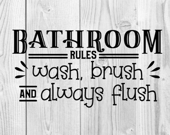 May include: Bathroom rules sign with black text on a white wood background. The sign reads "Bathroom Rules: Wash, brush, and always flush."