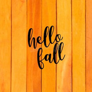 May include: Black text on a woodgrain background that reads "hello fall".