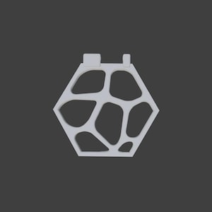 May include: A white, geometric pendant with a hexagonal shape and an open, organic design. The pendant features a series of interconnected, irregular shapes within the hexagon, and two small rectangular protrusions at the top. The background is a solid, dark gray.