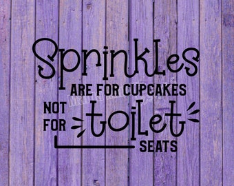 May include: A purple wooden sign with black text that reads "Sprinkles are for cupcakes, not for toilet seats".