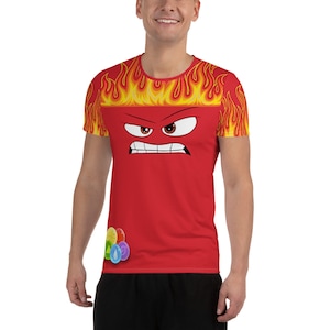 May include: Red t-shirt with a cartoon face of a character with an angry expression. The character has red skin, black eyebrows, and white eyes. The shirt has yellow flames on the sleeves and a multi-colored candy design on the front.