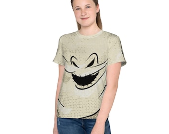 May include: A beige t-shirt featuring a black and white cartoon ghost face print. The ghost has a wide, toothy grin.