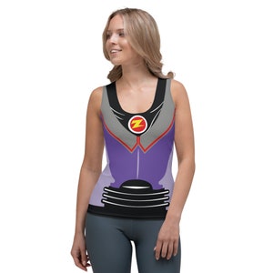 May include: A purple, gray, and black tank top with a red circle and a yellow letter Z in the center. The tank top has a black waistband with five silver rings.