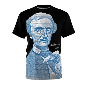 May include: A black t-shirt with a blue and white graphic print of Edgar Allan Poe and a raven. The text "Quoth the Raven, 'Nevermore'" is printed on the shirt.