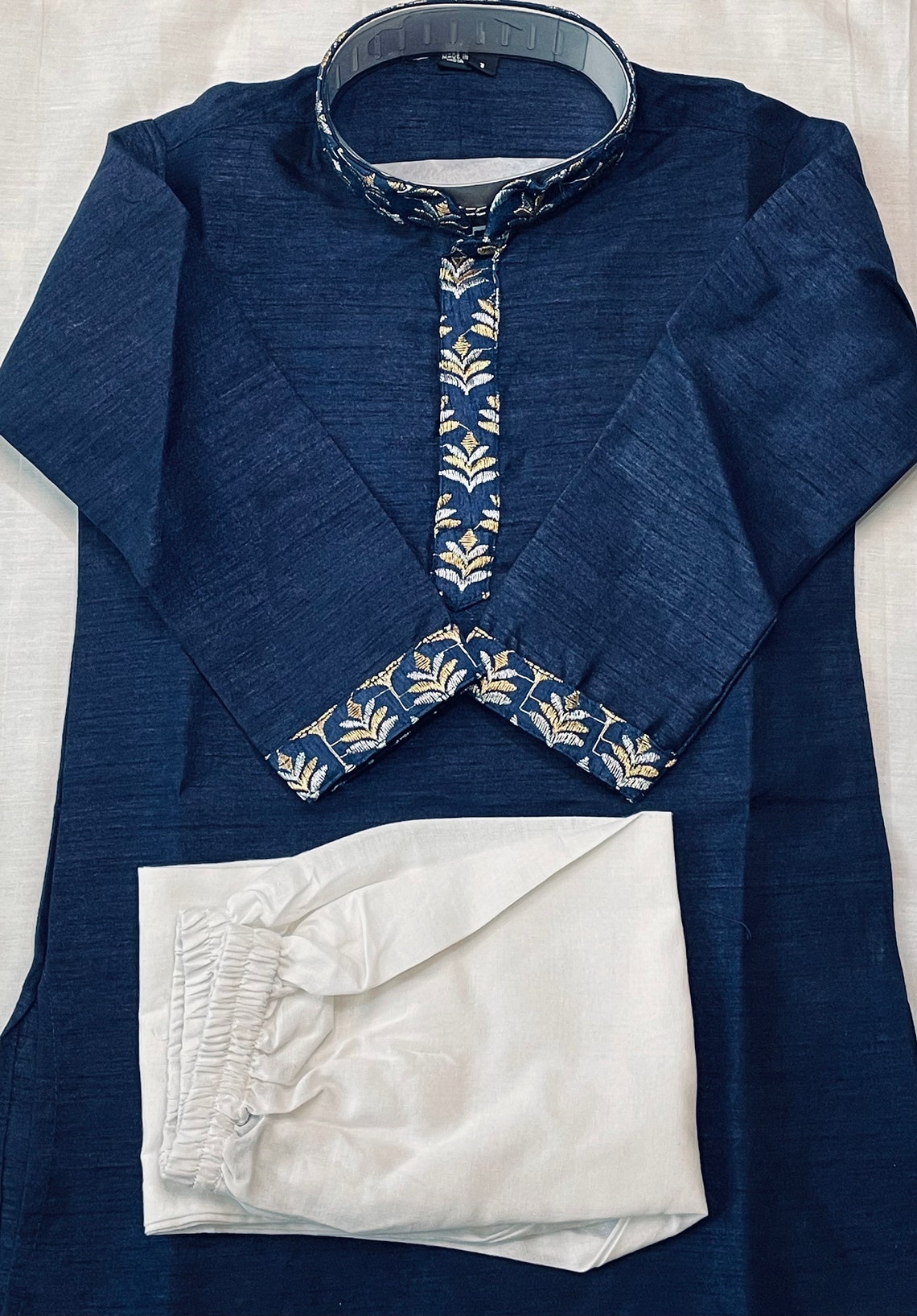 Boys Navy Blue Full Sleeves Cotton Kurta with Pyjama Pant Combo featuring an Embellished Neckline