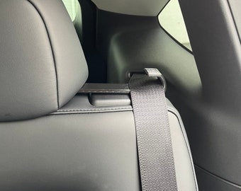 Tesla Model Y belt guide for rear seats