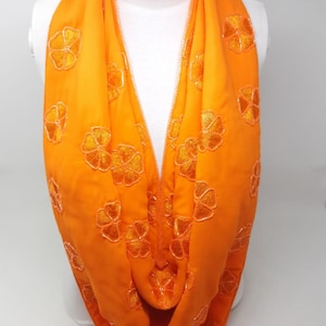 This vibrant One of a Kind handmade Magnetic scarf is made of Georgette fabric and finished off with Floral Beaded work which adds to beauty