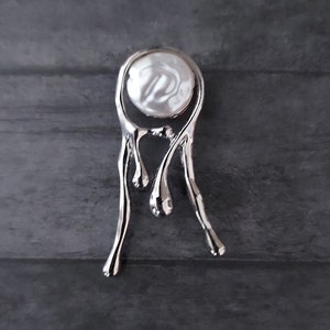 Magnetic brooch, lapel pin.  Faux pearl in silver tone metal.