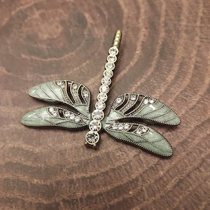 Magnetic Sage green Dragonfly brooch set in antique gold-tone metal.