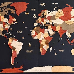 May include: A wooden world map with countries in various shades of brown, red, and beige, set against a dark blue background. The map includes ocean names and compass rose details. Small wooden sailboats are scattered across the oceans.