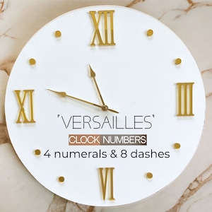 May include: White clock face with gold Roman numeral markings. The clock face says 'Versailles' and 'Clock Numbers 4 numerals & 8 dashes'.
