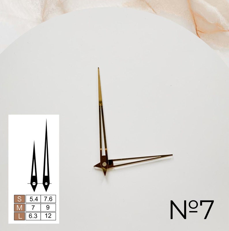 May include: Gold clock hands with a white background. The hands are labeled with sizes S, M, and L, with corresponding lengths in inches. The clock face also has the text "No. 7".
