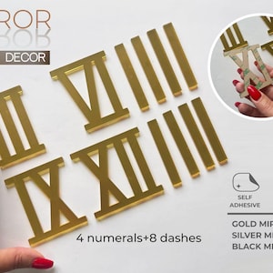 Könnte beinhalten: Goldene Spiegeluhrziffern und Striche für ein DIY-Uhrenprojekt. Das Set enthält vier römische Ziffern und acht Striche. Die Ziffern und Striche sind selbstklebend und haben eine spiegelnde Oberfläche. Das Bild zeigt die Ziffern und Striche auf einer weißen Oberfläche. Der Text "GOLDSPIEGEL, SILBERSPIEGEL, SCHWARZSPIEGEL" ist ebenfalls auf dem Bild zu sehen.