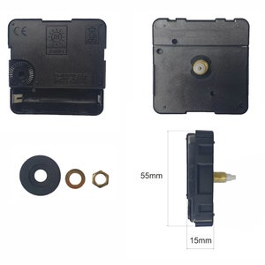 May include: Black clock mechanism with a white label that reads "Quartz Movement Made in China" and a black plastic nut. The mechanism is 14 cm tall and 3.8 cm wide.