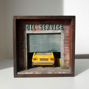 Ancien garage avec Volkswagen Golf Diorama